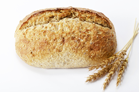 Homemade bread and ears of wheatの写真素材
