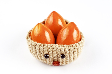 Seven persimmons on white background