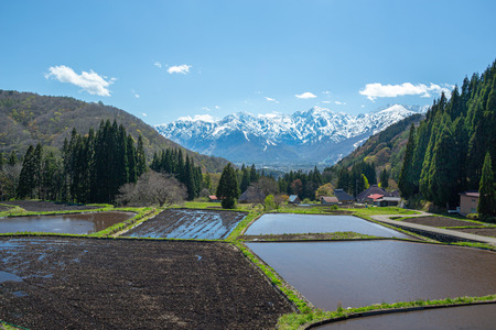 Beautiful view of Spring Snowy Mountain and mountain village.の写真素材