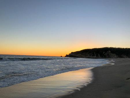Beautiful sunset on the beach in Oaxaca, Mexicoの写真素材