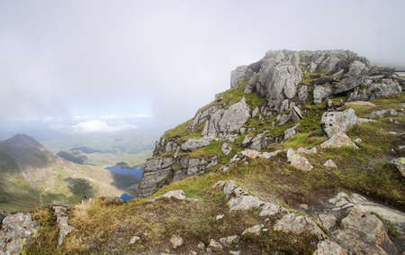 North Wales, United Kingdom - July 2018 : Tracks on the mountain rocks in Snowdonia National Park, View from the almost reach the highest point.のeditorial素材