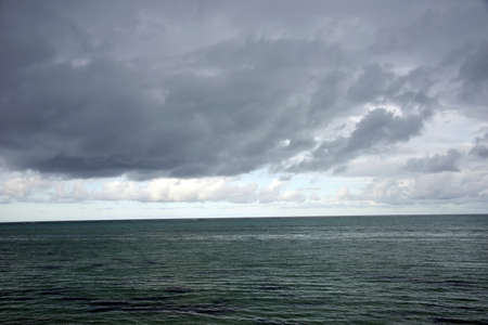 A ocean water surface under cloudy sky. Great impression of distance and solitude. Makes a nice...