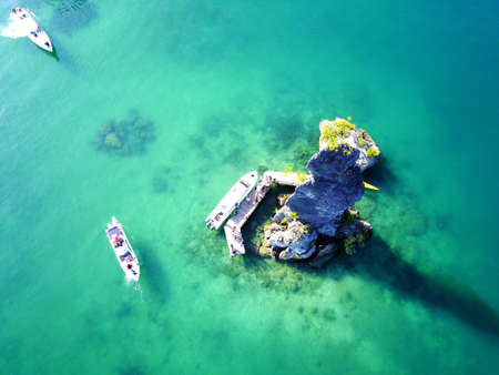 Aerial view of seascape with turquoise clear water and luxury boats taken by droneの写真素材