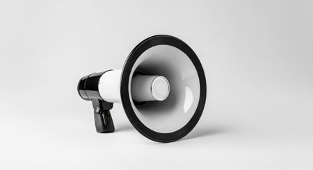 A black and white megaphone is shown from the side, isolated on a clean white background.の素材