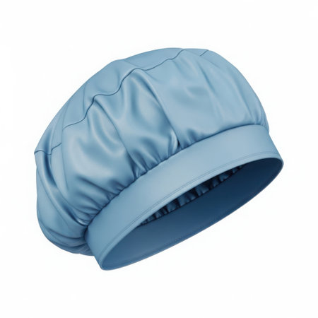 A single light blue bouffant cap with a wide elastic band, presented against a white background.の素材