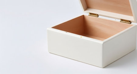 An empty, open white wooden box with a light wood interior, isolated on a clean white background.の素材