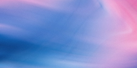 A soft, textured watercolor background featuring blended shades of blue and pink, creating an ethereal and dreamy effect.の素材