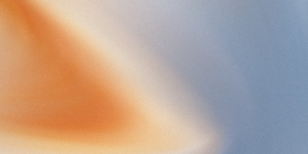 A gentle gradient transitions from a vibrant orange on the left to a serene blue on the right, with subtle textures.の素材