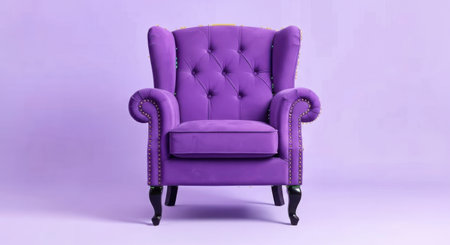 A plush, deep purple wingback armchair with button tufting and rolled arms is centered against a soft, muted purple backdrop.の素材