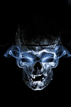Close up of skull on black background.の写真素材