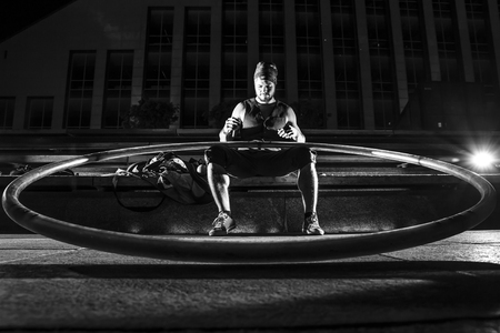 Cyr wheel performance session by young man at night.の写真素材