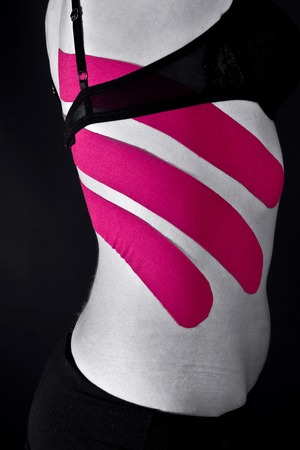 medical taping for ribs on black background.の写真素材