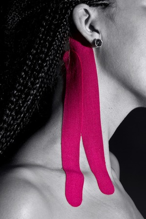 medical taping for releasing neck pain, black background.の写真素材