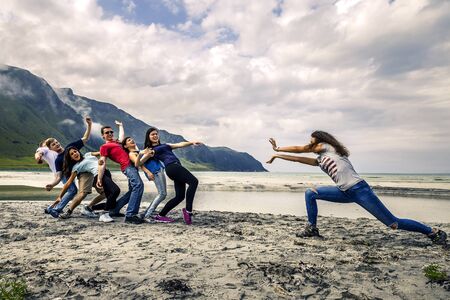 Group of people having fun on the beach of Norwayの写真素材