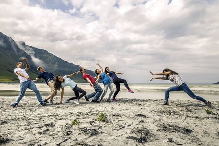 Group of people having fun on the beach of Norwayの写真素材