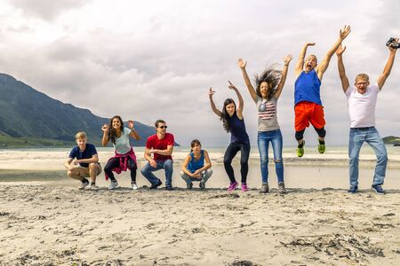 Group of young people is travelling around the Norwayの写真素材