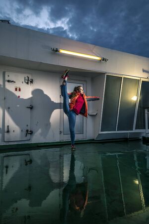 Young woman is having fun on the deckの写真素材