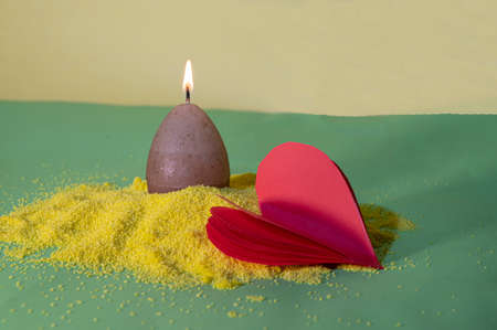 very nice valentines day red heart and candle yellow sand