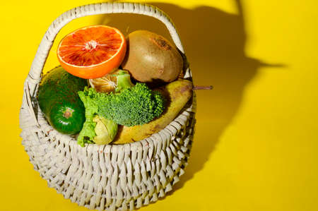 vegetables and fruits colorful fresh healthy food in the shopping basketの写真素材