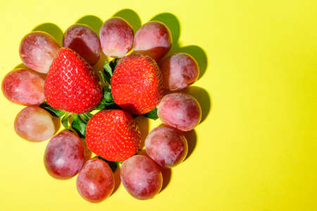 fruits decoration strawberry kiwi grape close upの写真素材