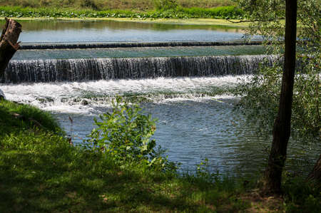 hot summer day with the waterfall close upの写真素材