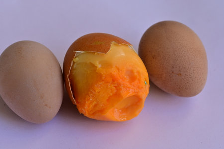 Boiled egg with yolk on a white background, close upの写真素材