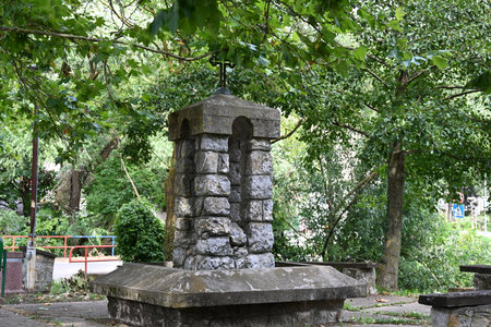 Old stone water well in the public park at Bangkok, Thailand.の写真素材
