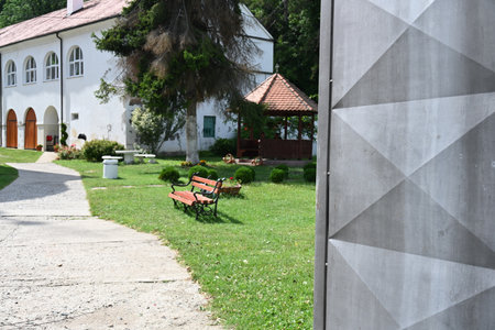 Lonely bench in front of an old house in Slovenia.の写真素材