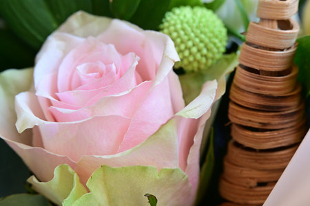 wedding bouquet of pink roses and green leaves close upの写真素材