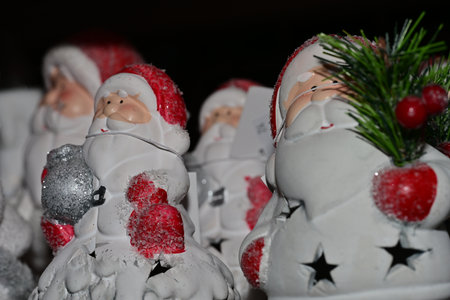 Christmas decoration with Santa Claus and angels on black background, closeupの写真素材