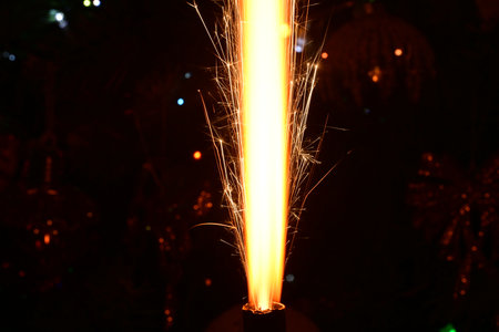 sparkler on the background of the Christmas tree and the New Yearの写真素材