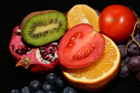 Fruits and vegetables on a black background. Healthy food concept.の写真素材