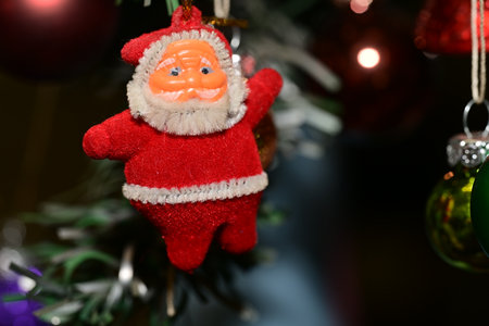 Santa Claus doll on christmas tree. Christmas and New Year background