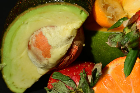 Fruit salad with avocado, orange, grapefruit and strawberries.