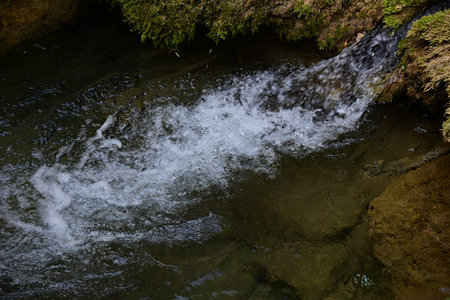 Waterfall in the forest, close-up of a small waterfall