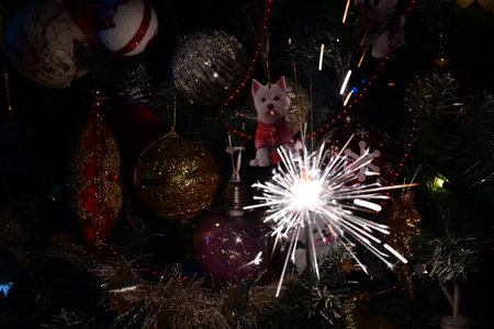 Christmas tree with burning sparklers and baubles, closeupの写真素材
