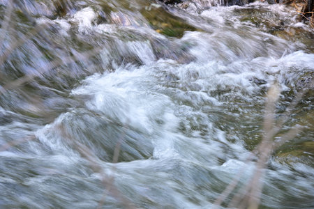 Mountain river in the forest close-up. Abstract natural background