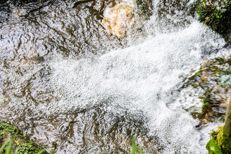 Water Flowing at Mae Fah Luang Waterfall, Thailand.の写真素材