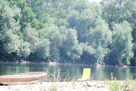 Boat on the bank of the river on a summer day.の写真素材