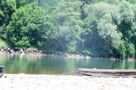 Fishing boat on the bank of the river in the forest.の写真素材