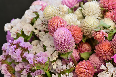 Bouquet of colorful flowers on black background, close-up