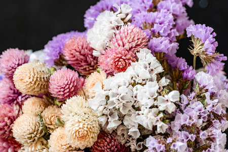 beautiful bouquet of dried flowers on black background, closeupの写真素材