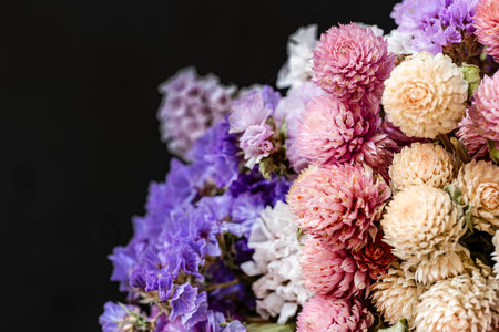 Bouquet of colorful flowers on a black background, close upの写真素材