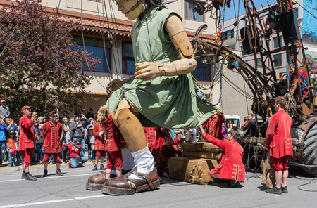 Montreal, Canada - May 20, 2017: The Little Girl-Giant presented by Royal de Luxe takes a walk on Viger Avenue to celebrate the 375th birthday of the city.のeditorial素材