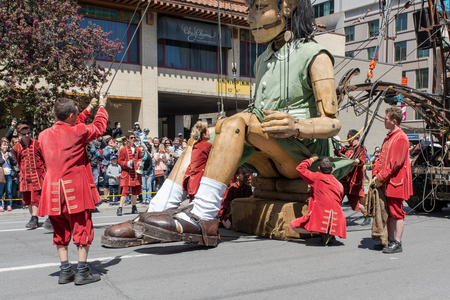 Montreal, Canada - May 20, 2017: The Little Girl-Giant presented by Royal de Luxe takes a walk on Viger Avenue to celebrate the 375th birthday of the city.のeditorial素材