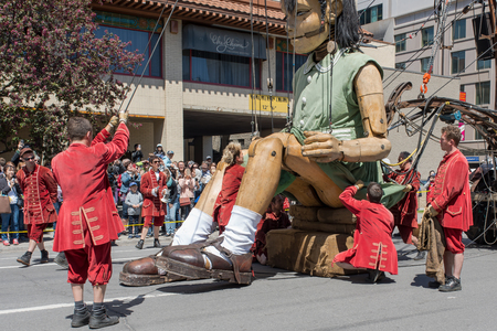 Montreal, Canada - May 20, 2017: The Little Girl-Giant presented by Royal de Luxe takes a walk on Viger Avenue to celebrate the 375th birthday of the city.のeditorial素材