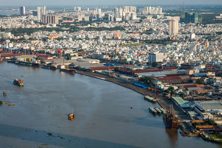 Stock photography Ho Chi Minh city, Vietnam. Beauty skyscrapers along river light smooth down urban...