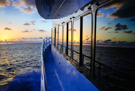 View from the deck of a cruise ship during a beautiful sunset.の写真素材