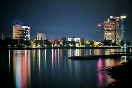 night view of the city by the river, closeup of photoの写真素材