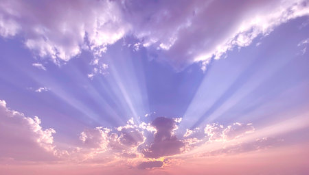 Sunset sky background with tiny clouds and bright rays of light.